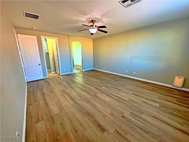 unfurnished bedroom featuring light wood-type flooring and ceiling fan