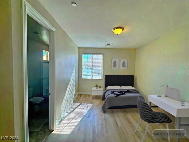 bedroom featuring light hardwood / wood-style floors