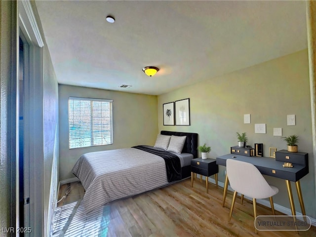 bedroom featuring hardwood / wood-style floors