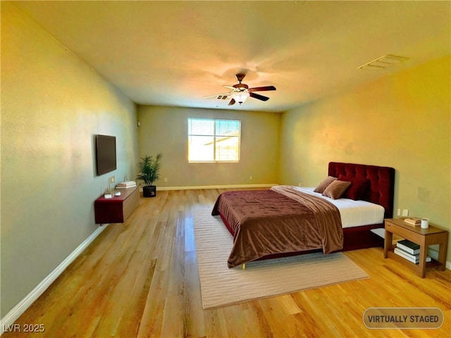 bedroom featuring ceiling fan and wood-type flooring