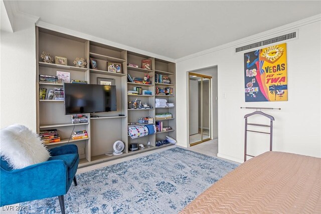sitting room featuring light carpet and crown molding