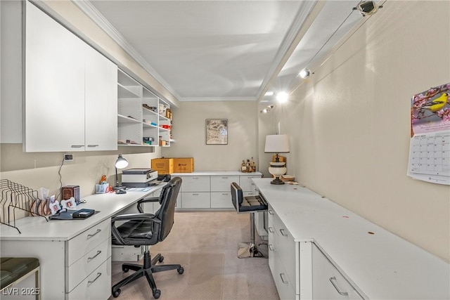 office space featuring crown molding and built in desk