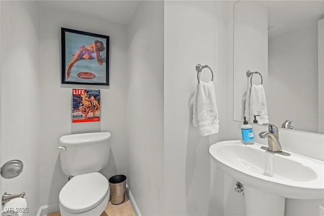bathroom featuring toilet and sink