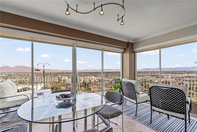 3111 Bel Air Dr Unit 20D, Las Vegas, NV 89109 - sunroom featuring a mountain view and healthy amount of natural light