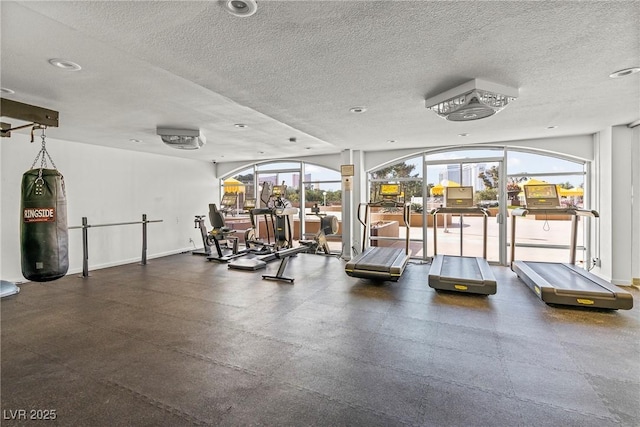 workout area with a textured ceiling