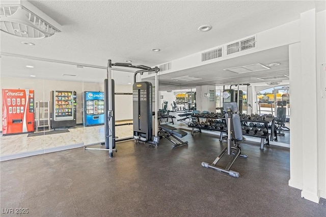exercise room with a textured ceiling