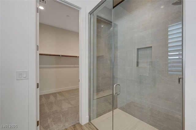 bathroom featuring an enclosed shower