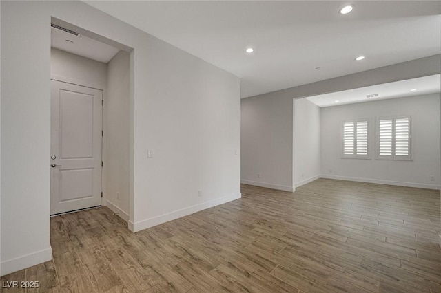 spare room featuring light hardwood / wood-style flooring