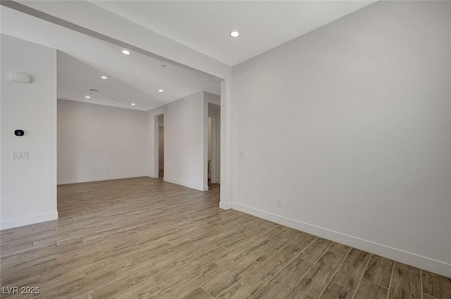 spare room featuring light wood-type flooring