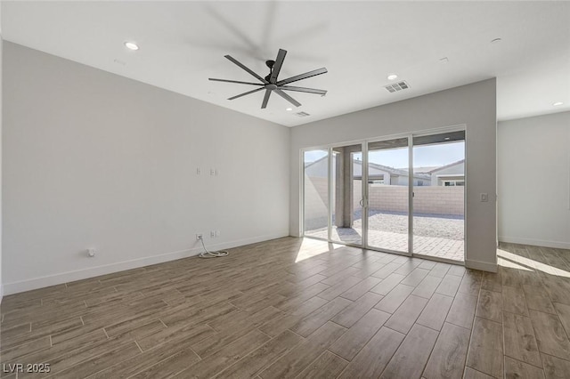 unfurnished room with dark wood-type flooring and ceiling fan