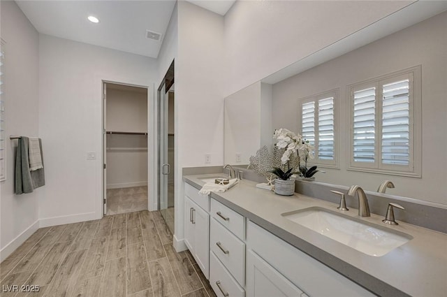 bathroom featuring vanity and hardwood / wood-style flooring