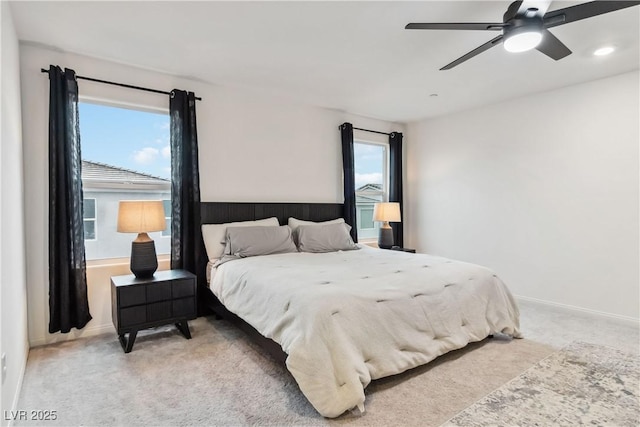 bedroom with light carpet and ceiling fan