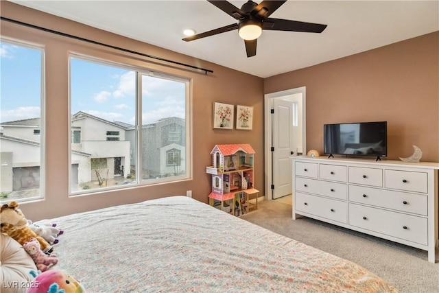 carpeted bedroom with ceiling fan