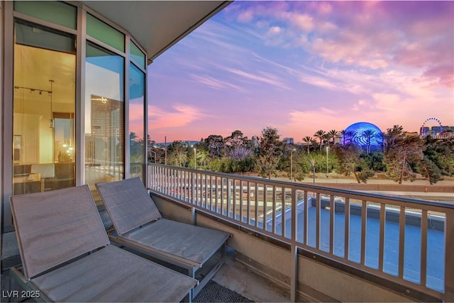 view of balcony at dusk