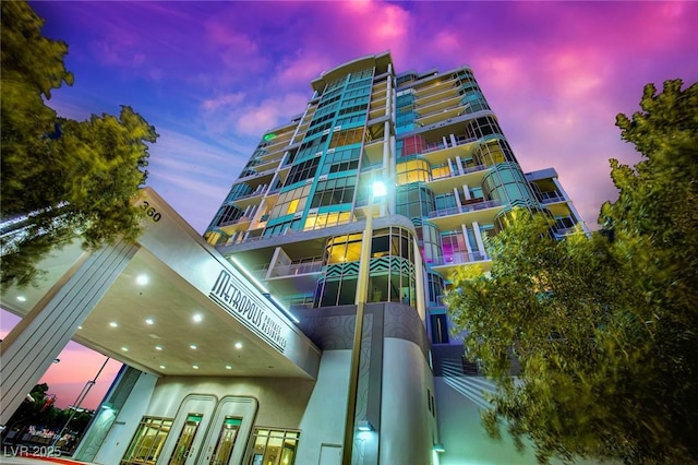 view of outdoor building at dusk