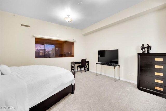 bedroom with light colored carpet