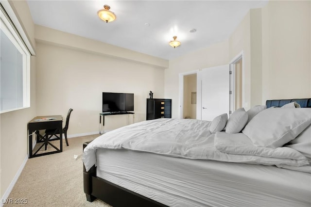 bedroom featuring light colored carpet