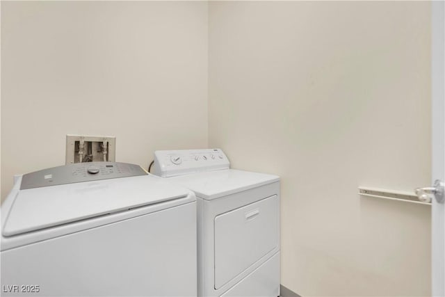 laundry room with washing machine and dryer