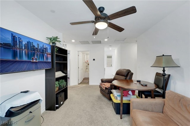 living room with light colored carpet and ceiling fan