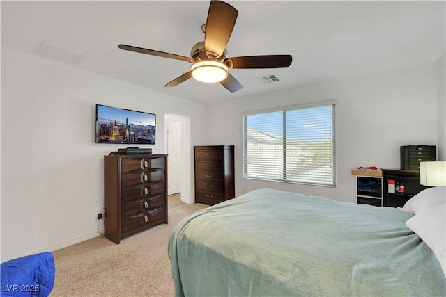 carpeted bedroom featuring ceiling fan