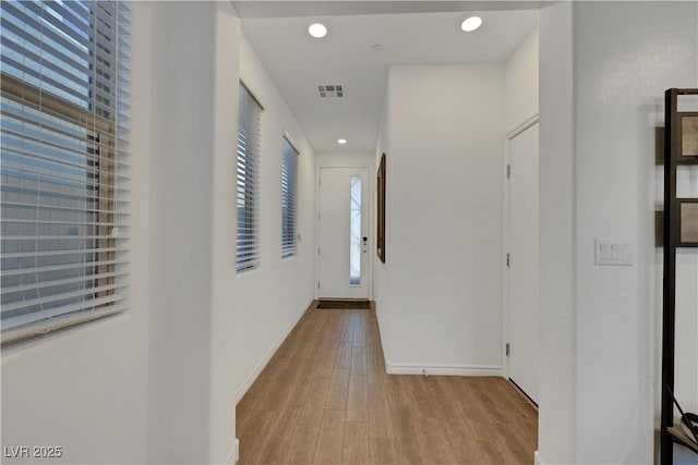 corridor featuring light hardwood / wood-style floors