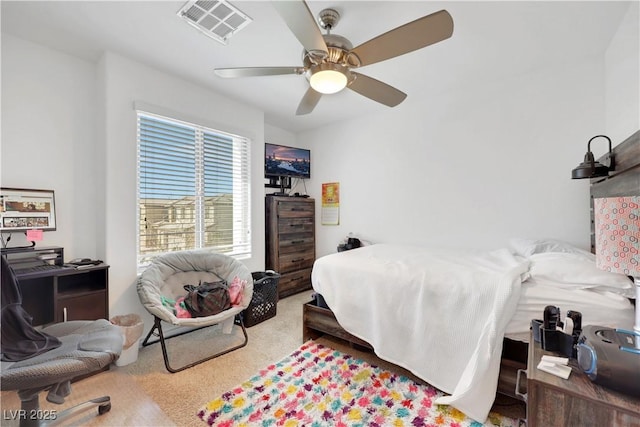 bedroom with ceiling fan and carpet flooring