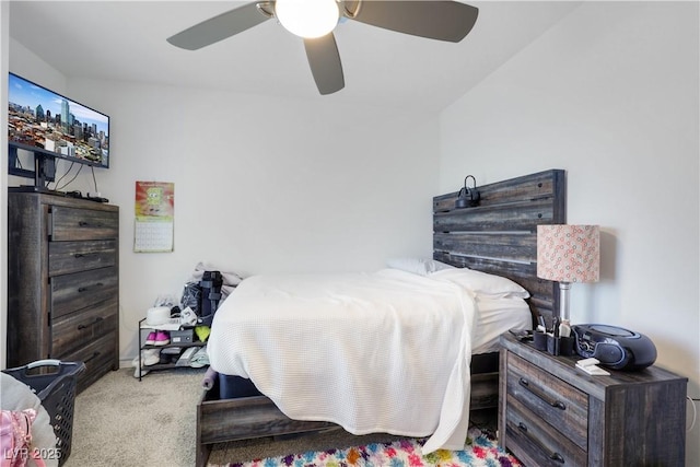 bedroom featuring light carpet and ceiling fan