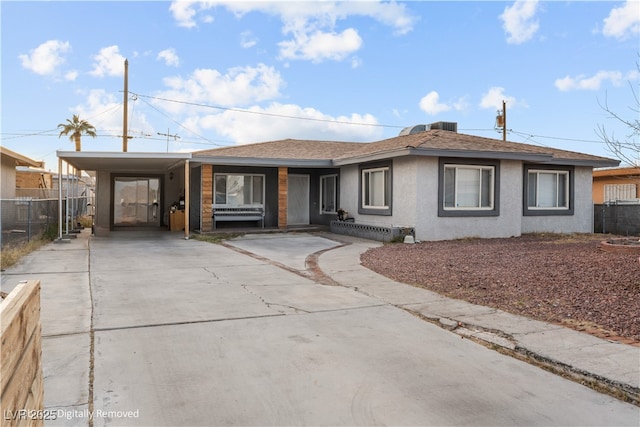 ranch-style home with a carport