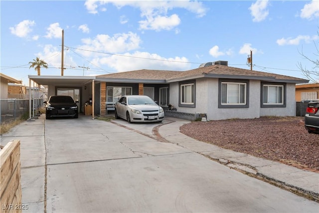 ranch-style house with a carport