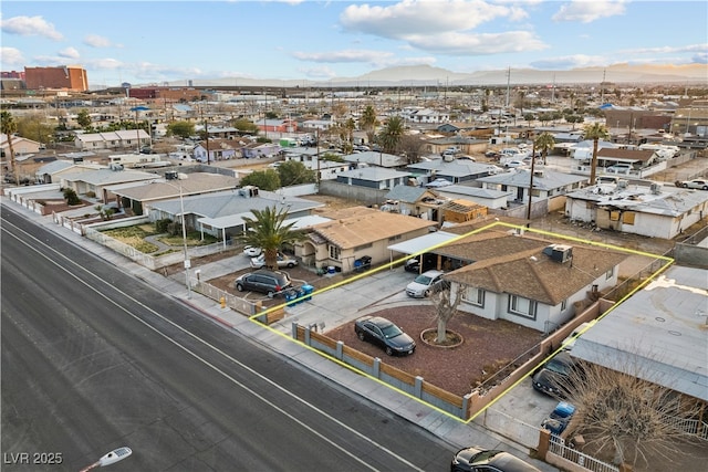 birds eye view of property with a mountain view