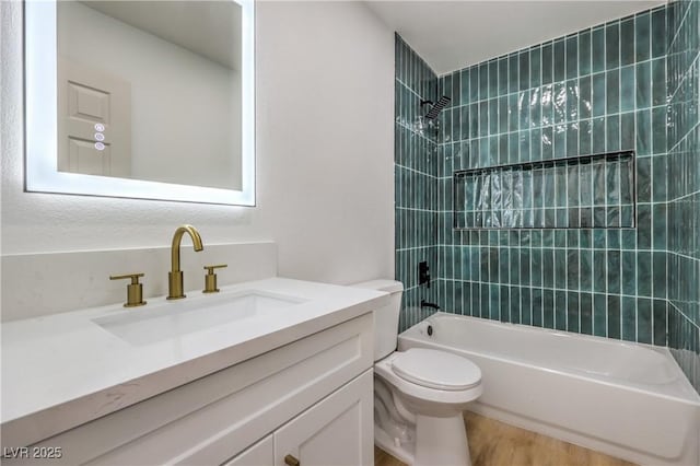 bathroom featuring toilet, vanity, shower / tub combination, and wood finished floors