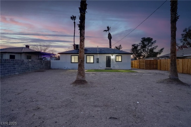 rear view of property with a fenced backyard