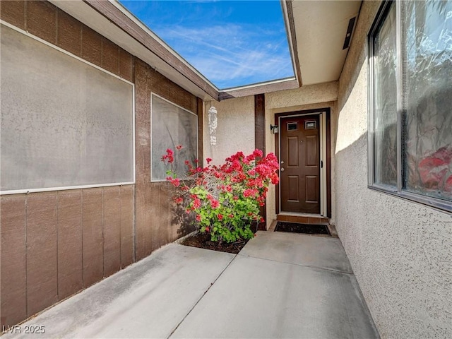 entrance to property featuring a patio area