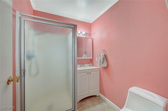 bathroom featuring ornamental molding, vanity, and an enclosed shower