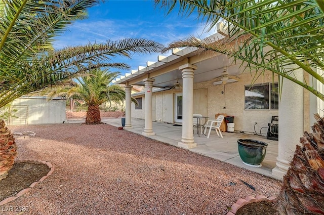 exterior space featuring ceiling fan