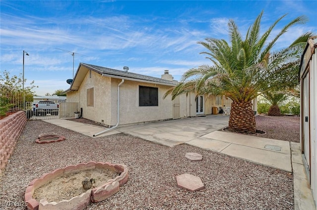 rear view of house with a patio