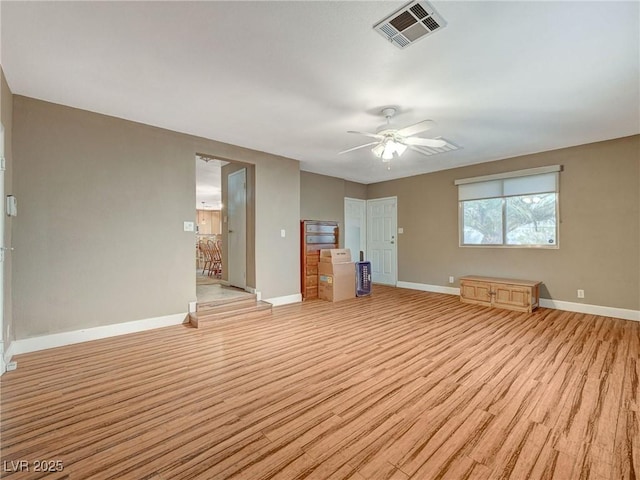 interior space with light wood-type flooring and ceiling fan