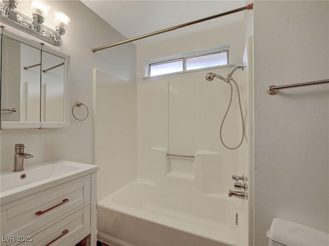 full bathroom featuring toilet, vanity, and shower / bath combination