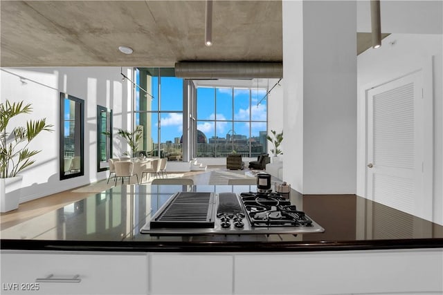 360 E Desert Inn Rd Unit 604, Las Vegas, NV 89109 - kitchen with dark countertops and wood finished floors