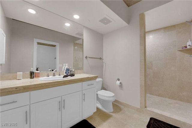 360 E Desert Inn Rd Unit 604, Las Vegas, NV 89109 - bathroom featuring vanity, toilet, walk in shower, recessed lighting, and baseboards