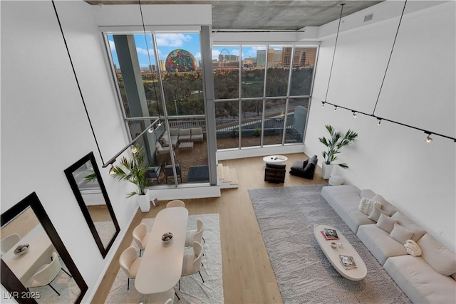 360 E Desert Inn Rd Unit 604, Las Vegas, NV 89109 - living area with wood finished floors, plenty of natural light, and a city view