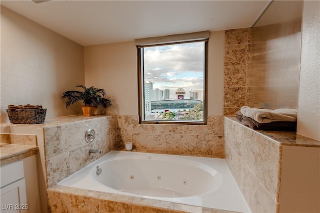 360 E Desert Inn Rd Unit 604, Las Vegas, NV 89109 - full bathroom featuring plenty of natural light, a jetted tub, and vanity