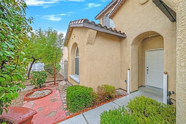 property entrance with a patio area