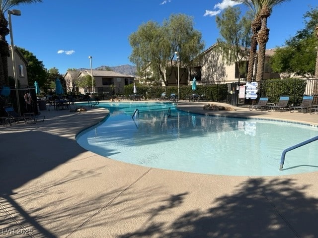 view of swimming pool with a patio