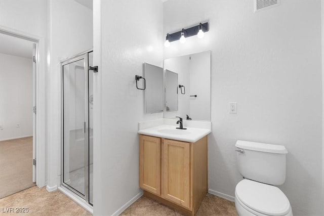 bathroom featuring a shower with door, vanity, and toilet