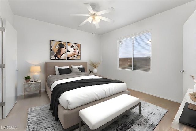 bedroom featuring light hardwood / wood-style floors and ceiling fan