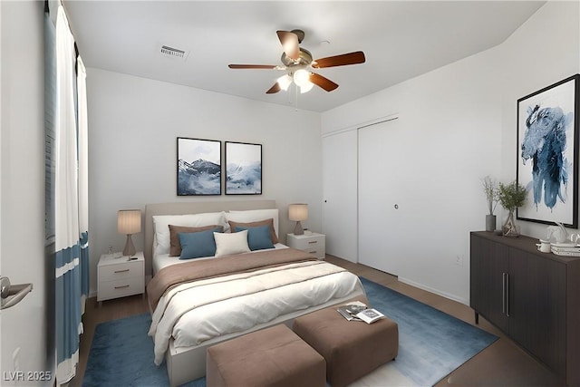 bedroom featuring ceiling fan and a closet