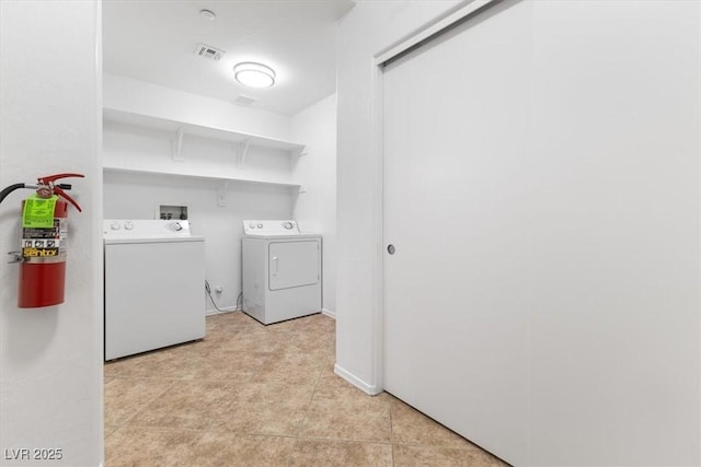 clothes washing area featuring washing machine and dryer