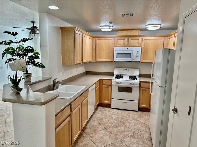 kitchen with sink, white appliances, a textured ceiling, light tile patterned floors, and ceiling fan