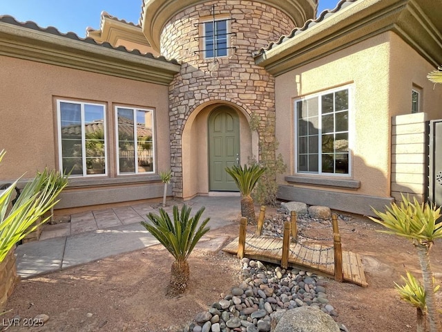 doorway to property featuring a patio area